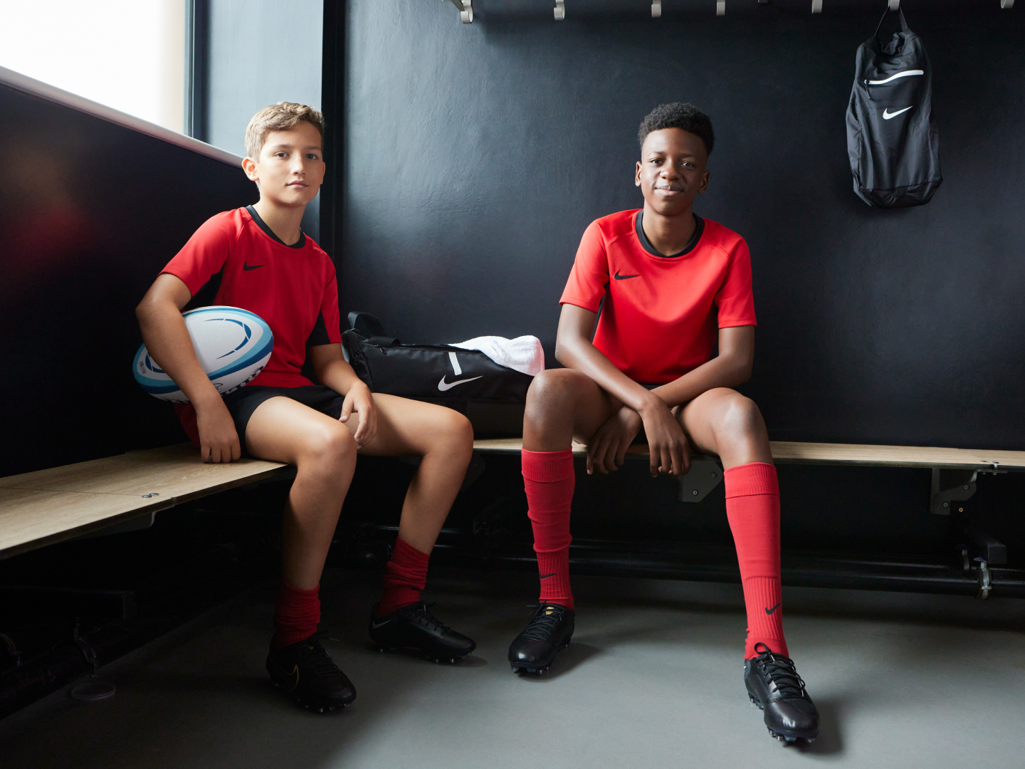 Zelus: Image of two boys in red Nike t-shirts